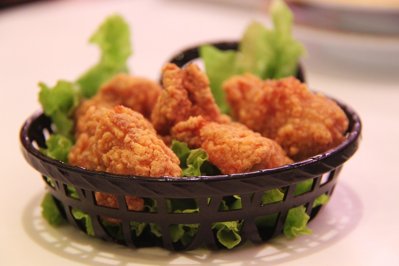 A basket of golden crispy fried chicken pieces